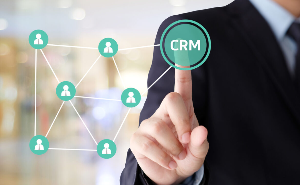 Businessman hand touch CRM, Customer Relationship Management, ic